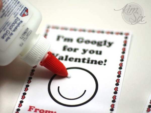 Gluing on google eyes to valentine