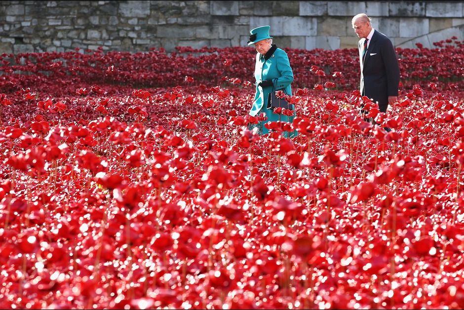 Queen Elizabeth II and Prince Philip, Duke of Edinburgh visit the Blood Swept Lands and Seas of Red evolving art installation at the Tower of London