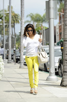 Eva Longoria wearing yellow pants