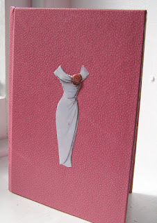 Pink notebook with vintage dress