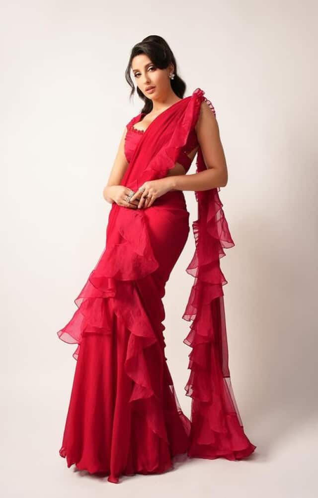 nora fatehi wreaked havoc in red ruffle saree