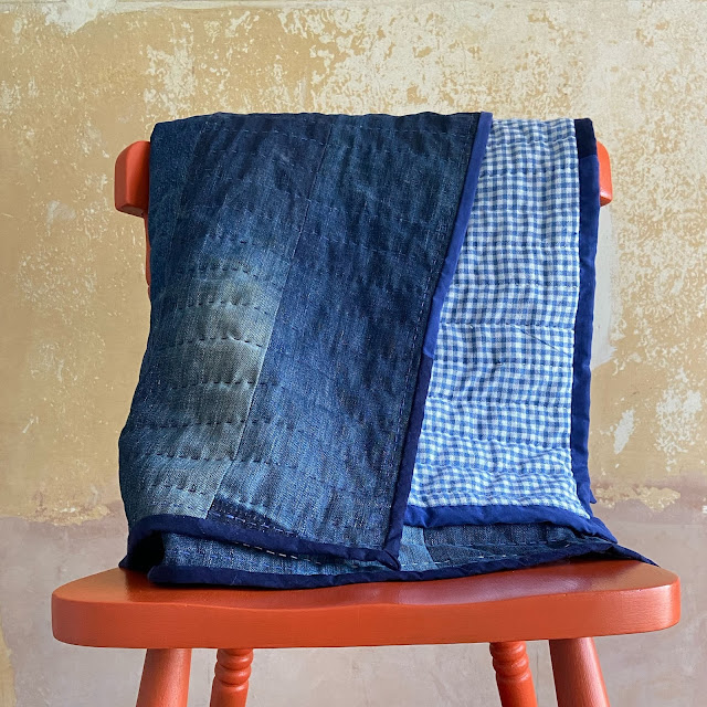 Denim quilt on an orange chair