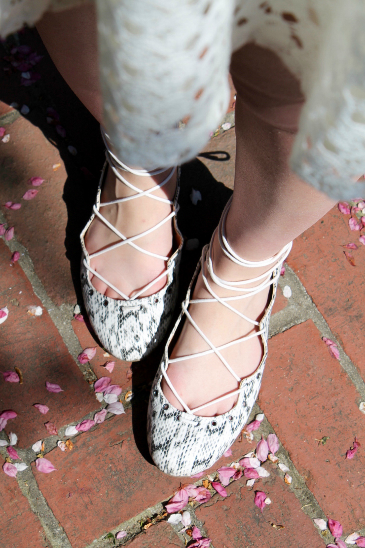 white lace dress, lace up snake skin ballet flats for a chic graduation outfit