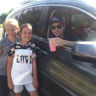 David Archuleta clicking picture with kids while sitting in a car