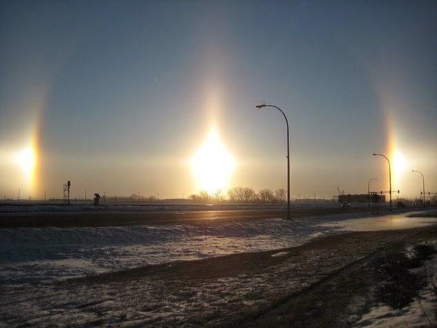 6. Sun dogs: This is a phenomenon that his actually another massive light refraction because of crystals in the atmosphere. Sun dogs appear to circle the sun and appear as two distinctive bright spots on either side of the halo. This phenomena can even make it look like there are three suns in the sky. - Sometimes Nature Is Awesome. Other Times, It’ll Scare The Life Out Of You. Like This.