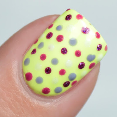 polka dot nail art on yellow base