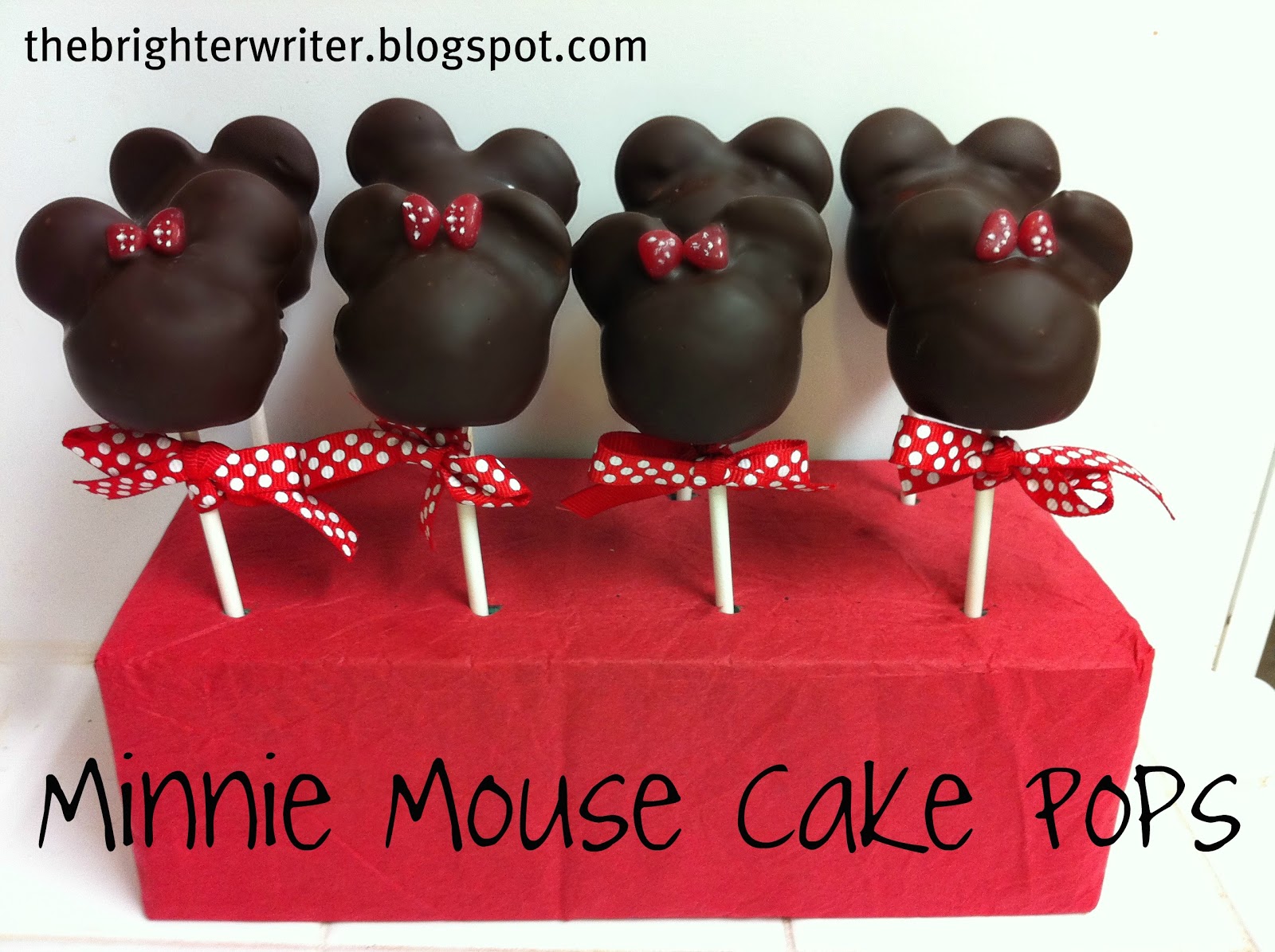 how to make minnie mouse cake pops  candy hearts back to back in between the ears to make minnie s bow