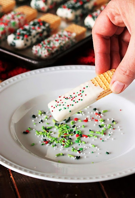 Sprinkling Christmas White Chocolate-Dipped Sugar Wafers with Sprinkles Image