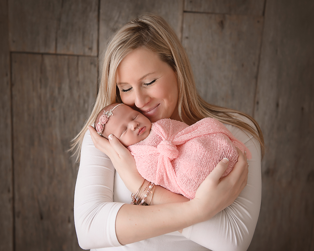 beautiful mother and newborn baby girl in DeKalb IL Newborn photography studio