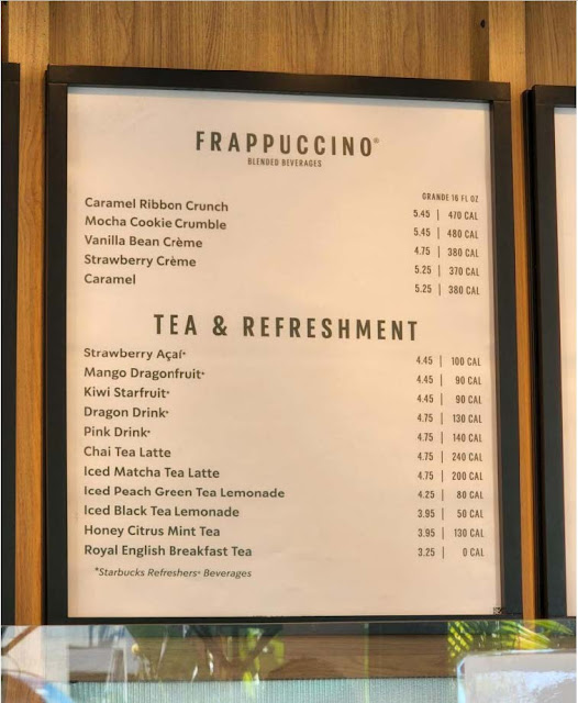 Starbucks menu board with names and prices