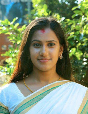 Malayali lady in traditional white saree. 