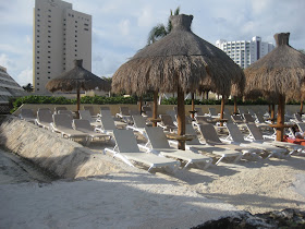 picture of the beach with huts in mexico