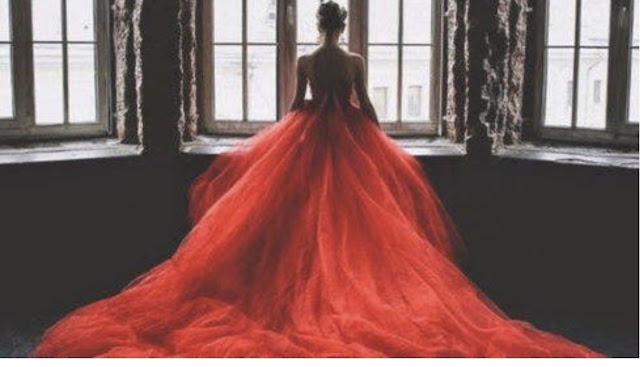 women in red gown dreaming