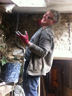 how to patch up an old stone wall in a derelict house in france