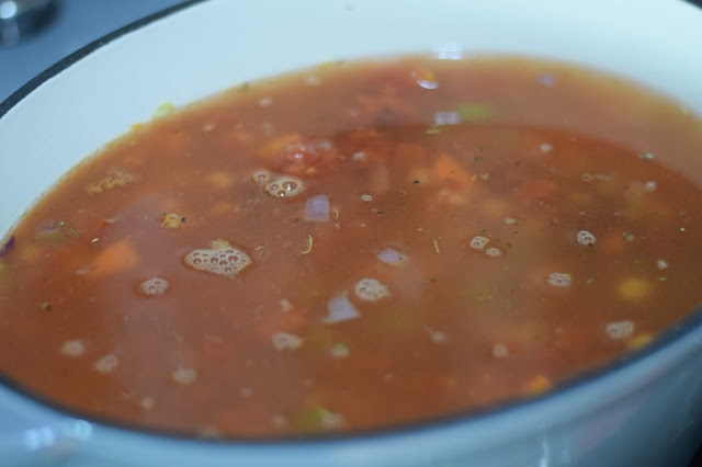 The vegetable broth in the pot. 