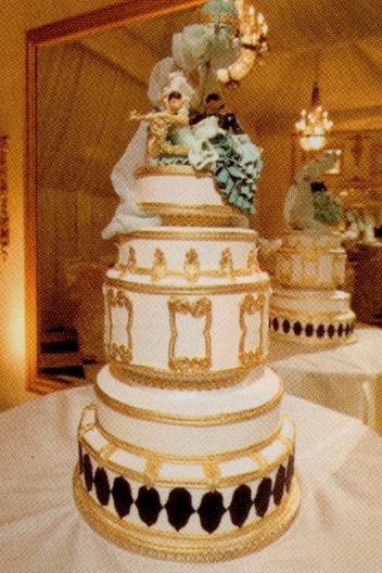  the white black turquoise and 24karat goldtrimmed cake has the 