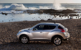 Silver Nissan Juke at the seashore,side profile