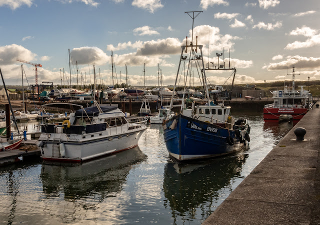 Photo of Laura Ann passing Ravensdale as she leaves Maryport Marina