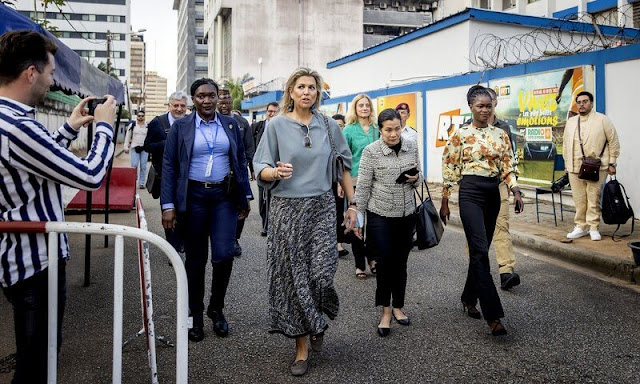 At the United Nations office in Abidjan, Queen Maxima wore a gray blue silk top, and floral print silk maxi skirt by Lanvin