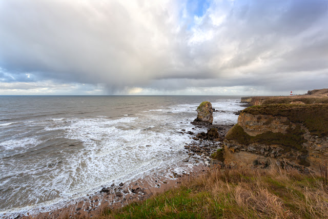 North East coastline at Marsden with stormy clouds and rock stacks