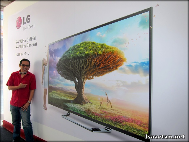 Isaac just chilling with the LG 84 inch HDTV banner