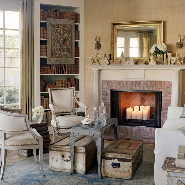 Nordic French furniture near fireplace in California beach cottage in Santa Monica by Giannetti Home