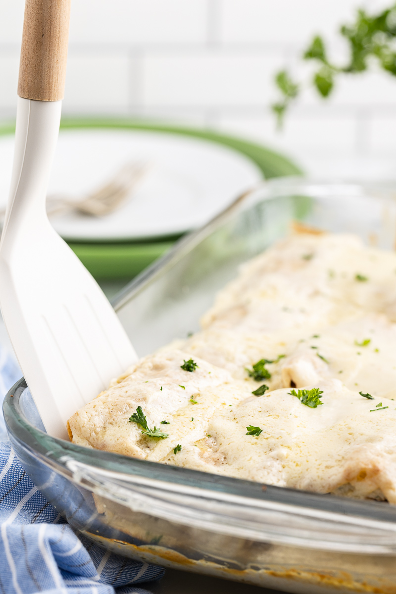 Low Carb Chicken Alfredo Rollups in a glass baking dish.