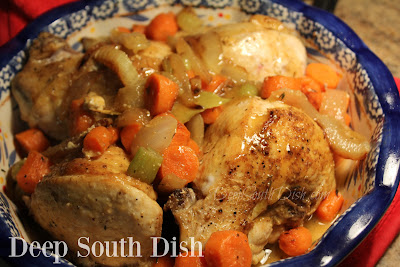 Bone-in, skin-on chicken breasts, simply seasoned with salt, pepper and garlic powder, oven braised in a light sauce of chicken broth and wine, with vegetables