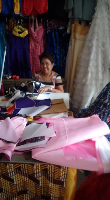 Sastre Edelina working on a Filipiniana Gown