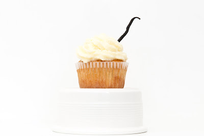 An iced vanilla cupcake - not the same as vanilla ice - very different in fact