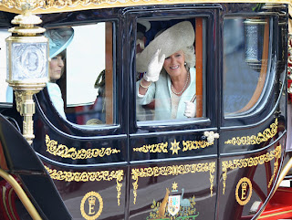 Mother of the Bride Carole Middleton (l.) and Camilla, Duchess of Cornwall make the journey by carriage procession to Buckingham Palace after the Royal Wedding.