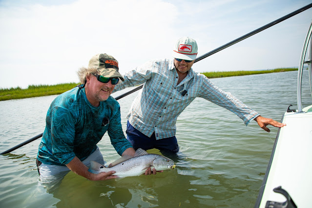 Fly fishing isn't just for trout, here's a photo of Brian Flechsig and Blane Chocklett catching redfish on the fly