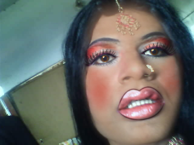  See the photo of indian Crossdresser with al those Bridal Makeup