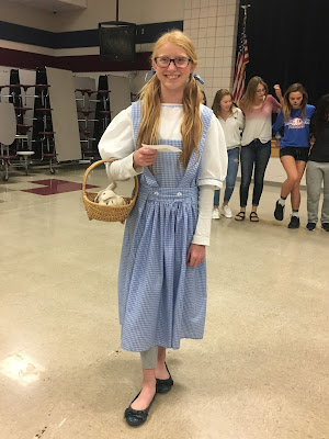 Middle school girl dressed as Dorthy from the Wizard of Oz