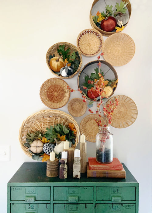 Thrifted basket wall gallery with real dried leaves.
