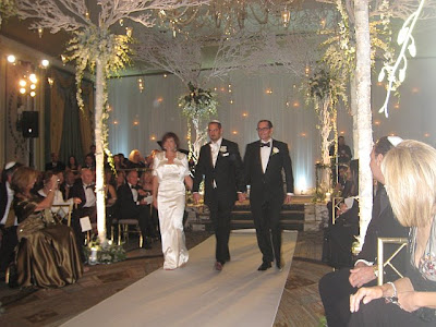  white and the chuppah looked snow had just fallen onto a canopy of trees 
