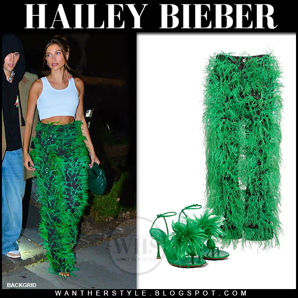 Hailey Bieber in green feather trousers and crop top