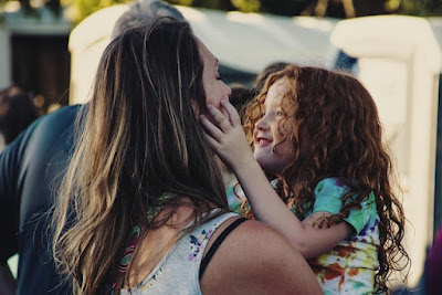 A mom with her daughter.