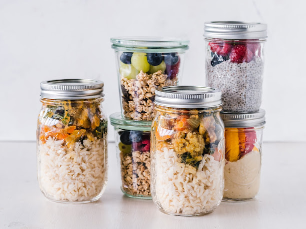 Fresh and colorful ingredients layered in glass jars, ready for a quick and easy meal.