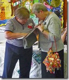 Rummaging in her handbag!!