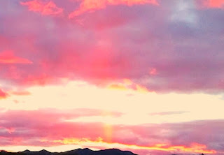 sun at horizon, variegated sky, Prescott Arizona, Sierra Prieta Mountains
