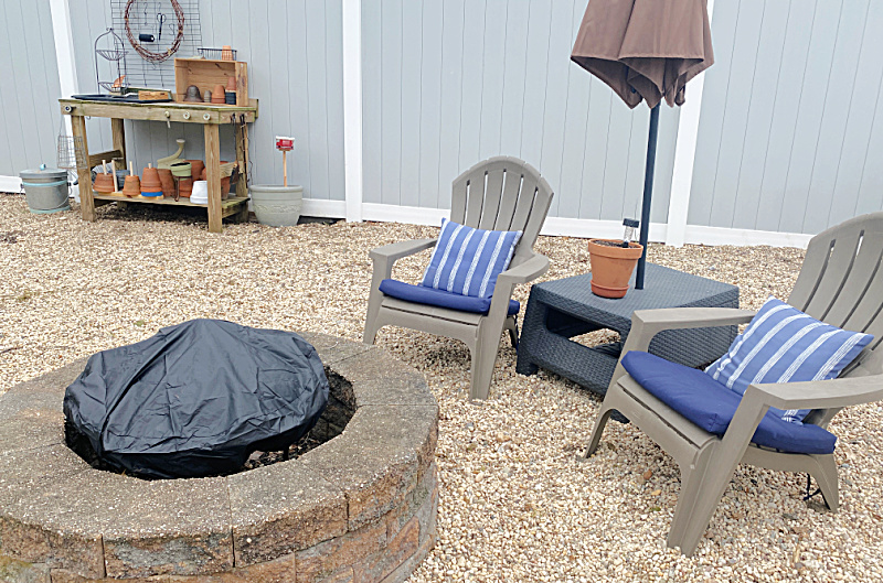 outdoor fire pit area and potting bench