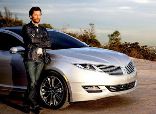 Pat McConaughey's brother Matthew posing for picture with car