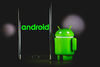 An Android phone with a home button and a green Android Robot.