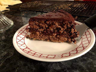 Cut with a bread knife, but served on a pie cutter.  We have a cake serving spatula thing somewhere...