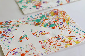 http://buggyandbuddy.com/easy-art-projects-kids-splatter-paint-tape-resist/