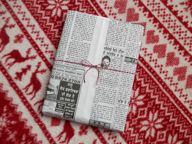 Wrap presents with newspaper and fabric.  Make one small change - ditch the wrapping paper.  secondhandsusie.blogspot.co.uk