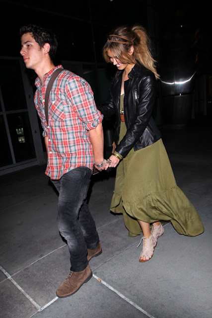 Nick Jonas Holds Rapidly to New Girlfriend Delta Goodrem