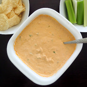 Blue Cheese Buffalo Chicken Dip:  A warm and spicy dip made with cream cheese, sour cream, blue cheese, chicken, and buffalo sauce.