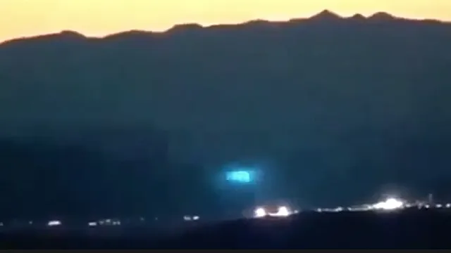 An unbelievable electric blue UFO sighting over Area 51 at night time in secret.